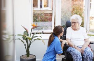 nurse with an elderly woman in an assisted living facility